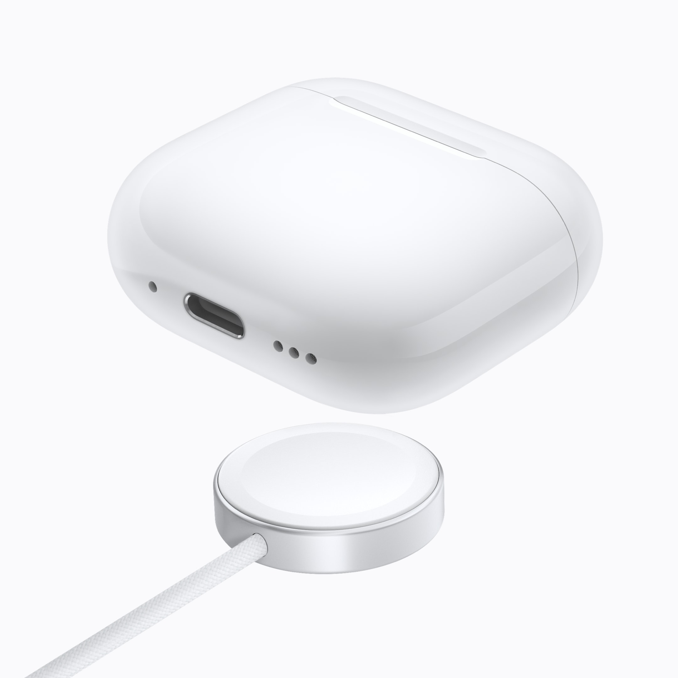 AirPods 5 con Estuche de Carga Inalámbrica sobre un cargador
